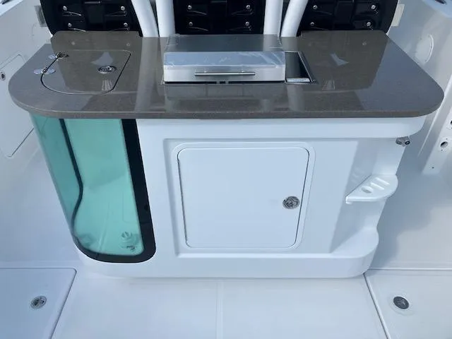 Slide: The Image of 2025 Wellcraft 352 Fisherman boat console with storage and livewell. - 10