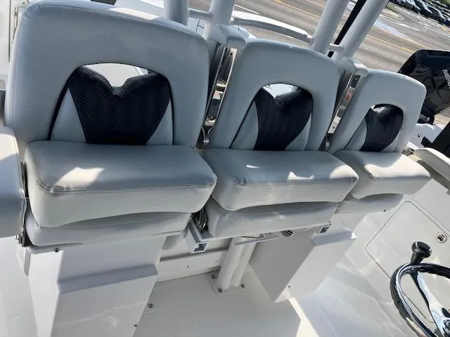 Slide: The Image of 2025 Wellcraft 352 Fisherman boat seats, sleek gray design, modern marine interior. - 11