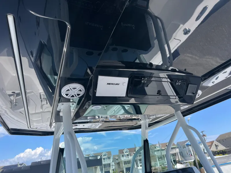 Slide: The Image of 2025 Wellcraft 352 Fisherman boat console with Mercury electronics and speakers. - 20