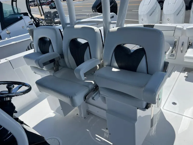 Slide: The Image of 2025 Wellcraft 352 Fisherman boat interior with modern seating and controls. - 22