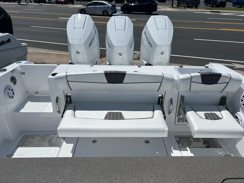 Slide: The Image of 2025 Wellcraft 352 Fisherman boat with triple Mercury engines and seating. - 30
