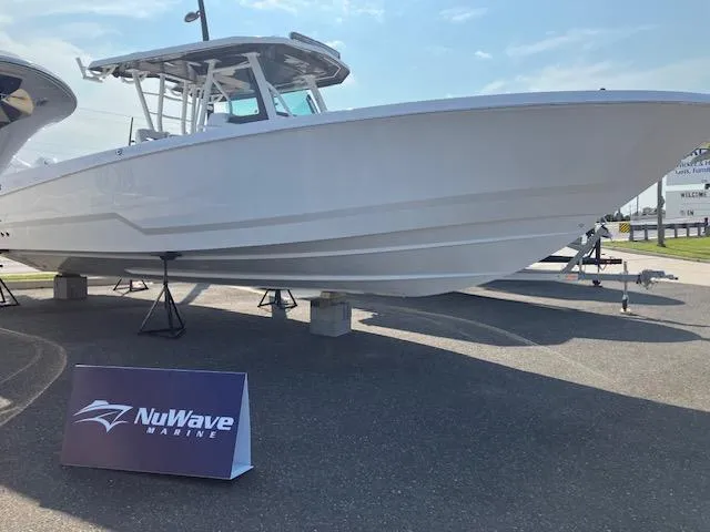 Slide: The Image of 2025 Wellcraft 352 Fisherman boat displayed at NuWave Marine dealership. - 4