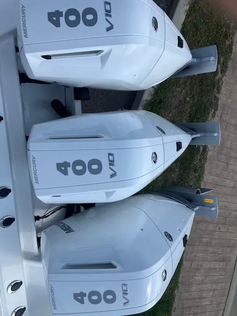 Slide: The Image of Triple Mercury 400 V10 outboard engines on a 2025 Wellcraft 352 Fisherman boat. - 7