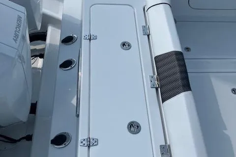 Slide: The Image of 2025 Wellcraft 352 Fisherman boat deck with Mercury engine and storage compartments. - 8