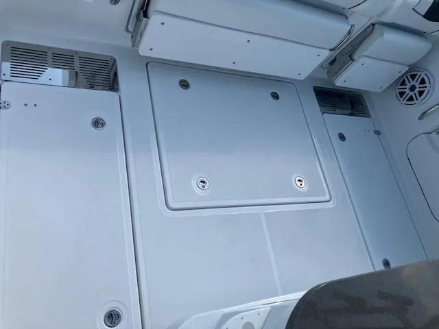 Slide: The Image of 2025 Wellcraft 352 Fisherman boat deck with storage compartments and speaker. - 9