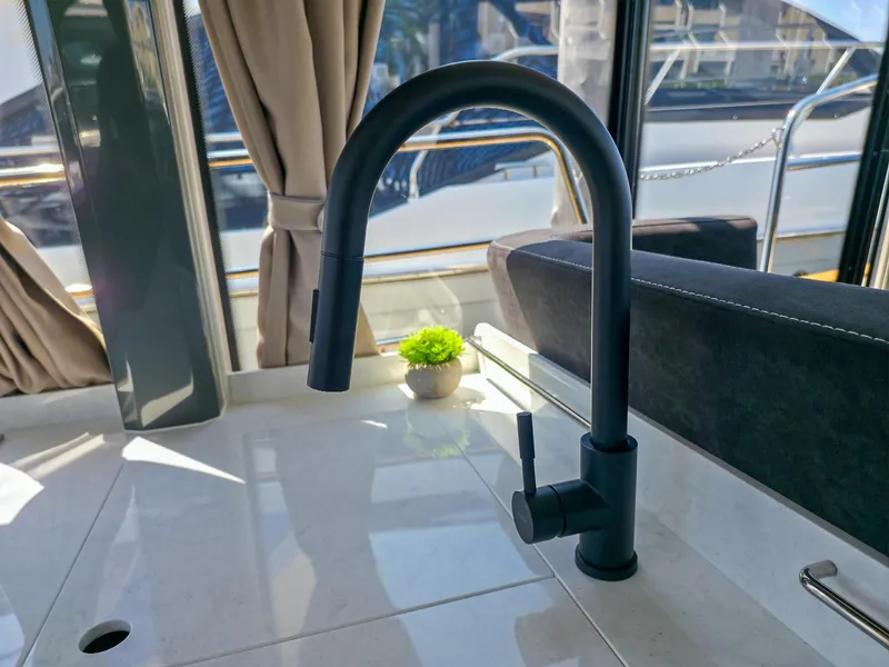 Slide: The Image of Modern kitchen faucet on Marex 440 yacht, 2026 model, with sleek design and natural light. - 38