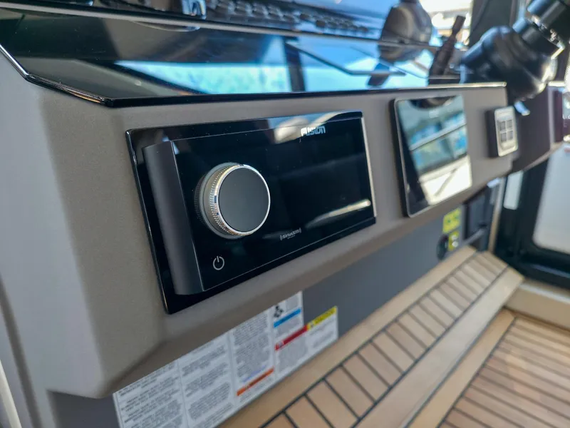 Slide: The Image of Control panel of 2026 Marex 440 boat with modern navigation equipment. - 55