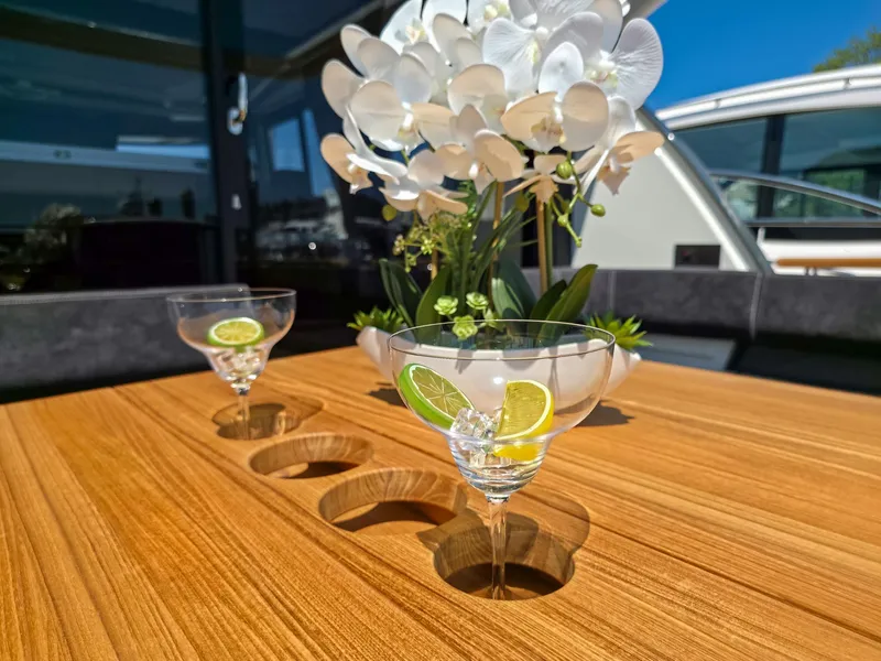 Slide: The Image of Luxury yacht Marex 440, 2026 model, with elegant table setting and floral decor. - 21