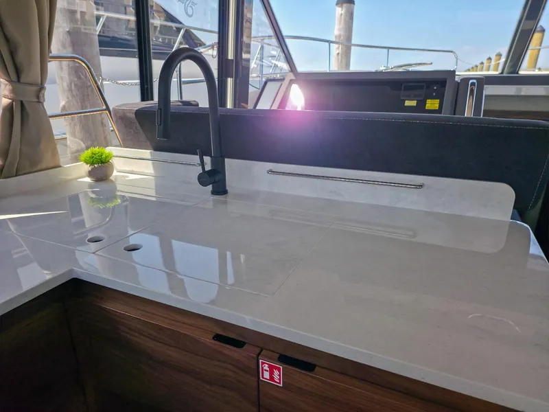 Slide: The Image of Modern kitchen area on 2026 Marex 440 yacht with sleek countertop and faucet. - 37