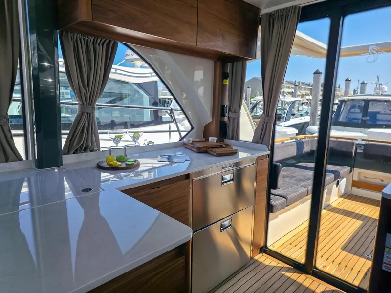 Slide: The Image of Luxurious interior of 2026 Marex 440 yacht with modern kitchen and seating area. - 42