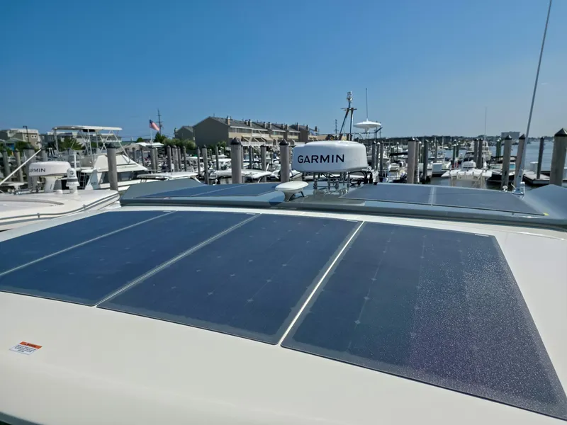 Slide: The Image of Solar panels on 2026 Marex 440 yacht, docked with Garmin equipment visible. - 23