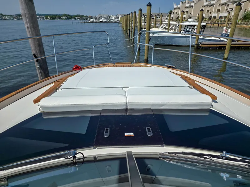 Slide: The Image of 2026 Marex 440 yacht bow view at marina, showcasing sleek design and waterfront setting. - 24
