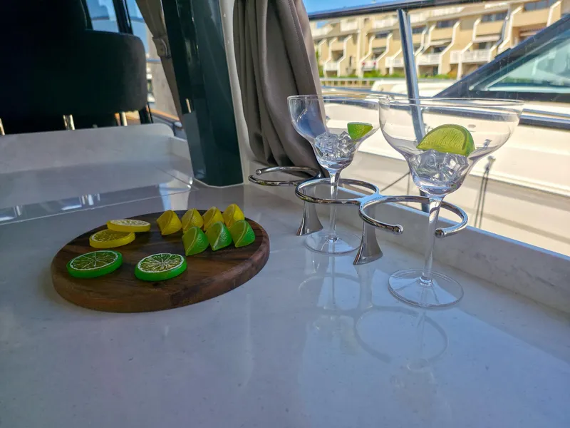 Slide: The Image of Interior of Marex 440 yacht with lime garnishes and cocktail glasses, 2026 model. - 36