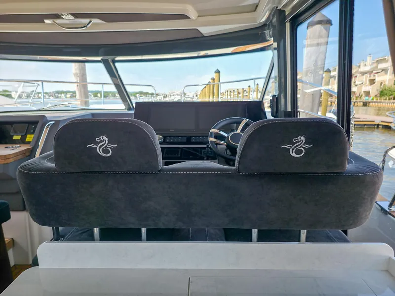Slide: The Image of Interior view of 2026 Marex 440 yacht cockpit with dual seats and steering wheel. - 47