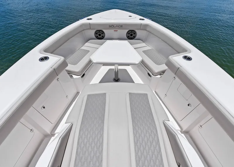 Slide: The Image of Luxurious seating area on 2025 Solace 32 CS boat, featuring elegant design and comfort. - 12