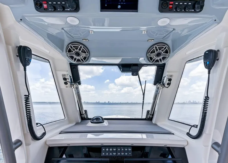 Slide: The Image of Interior view of 2025 Solace 32 CS boat cockpit with ocean view. - 22