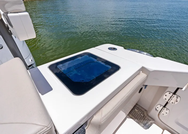 Slide: The Image of 2025 Solace 32 CS boat interior with seating and water view. - 29