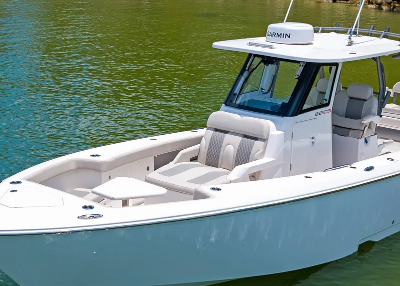 Slide: The Image of 2025 Solace 32 CS boat on calm water, featuring sleek design and modern amenities. - 3