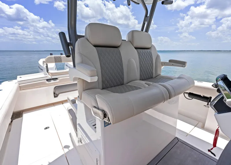 Slide: The Image of 2025 Solace 32 CS boat interior with luxurious seating and ocean view. - 37