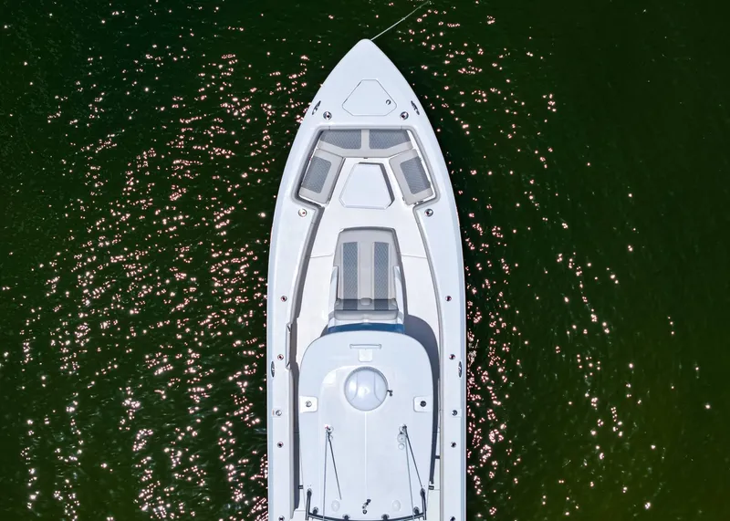 Slide: The Image of Aerial view of 2025 Solace 32 CS boat on sparkling green water. - 7
