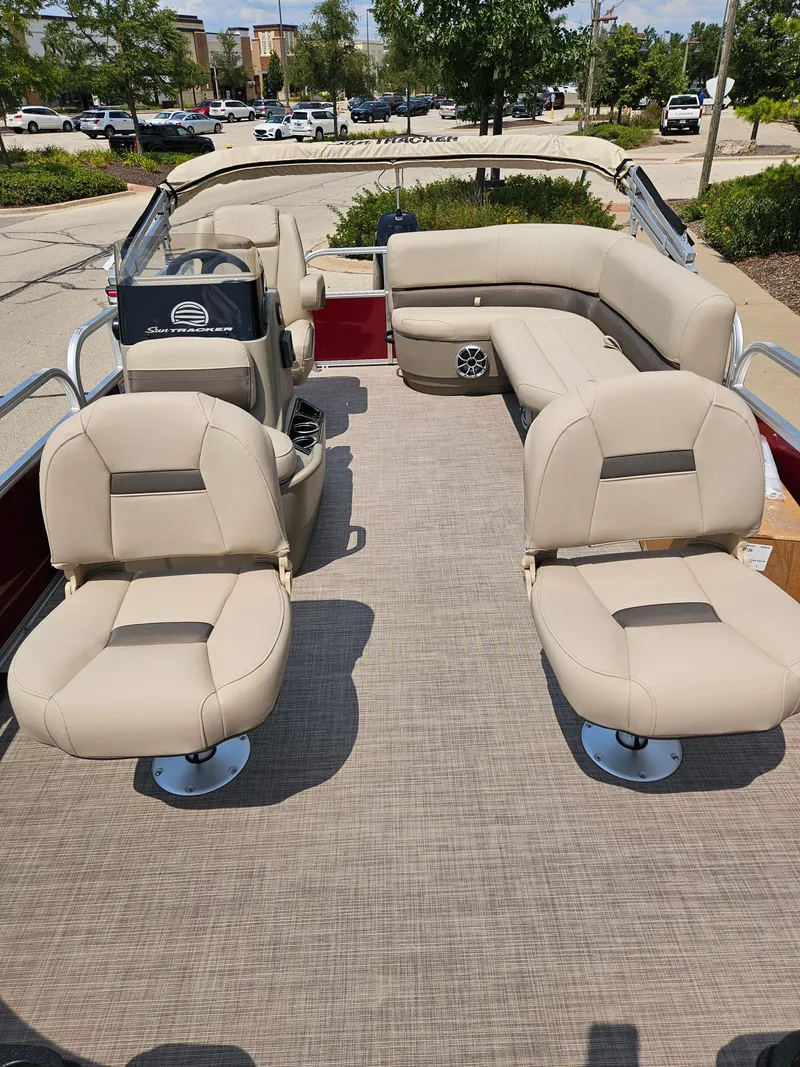 Slide: The Image of 2025 Bass Tracker BB16XLS boat interior with beige seating and spacious layout. - 3