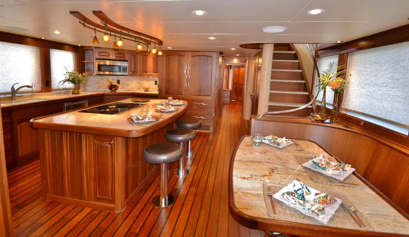 Slide: The Image of Luxurious 2018 Allseas Expedition yacht interior with elegant wood finishes and modern kitchen amenities. - 15