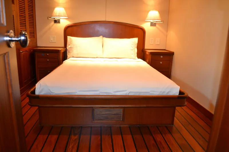 Slide: The Image of Luxurious wooden bedroom interior on 2018 Allseas Expedition yacht, featuring cozy lighting and elegant design. - 22