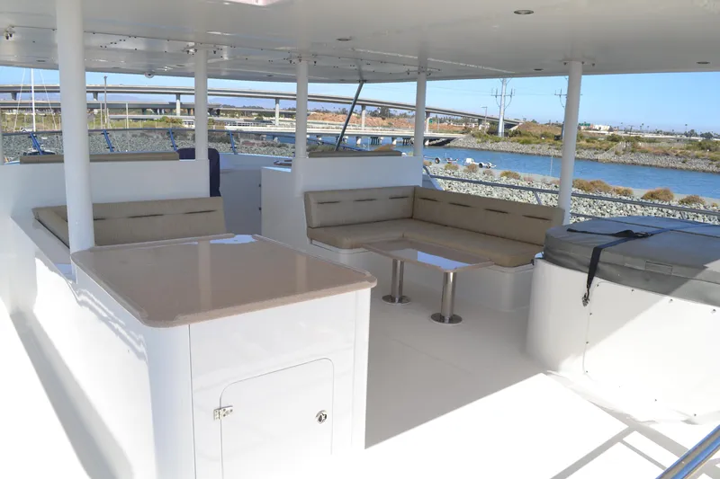 Slide: The Image of Spacious deck of 2018 Allseas Expedition yacht with seating and table, overlooking waterway. - 31