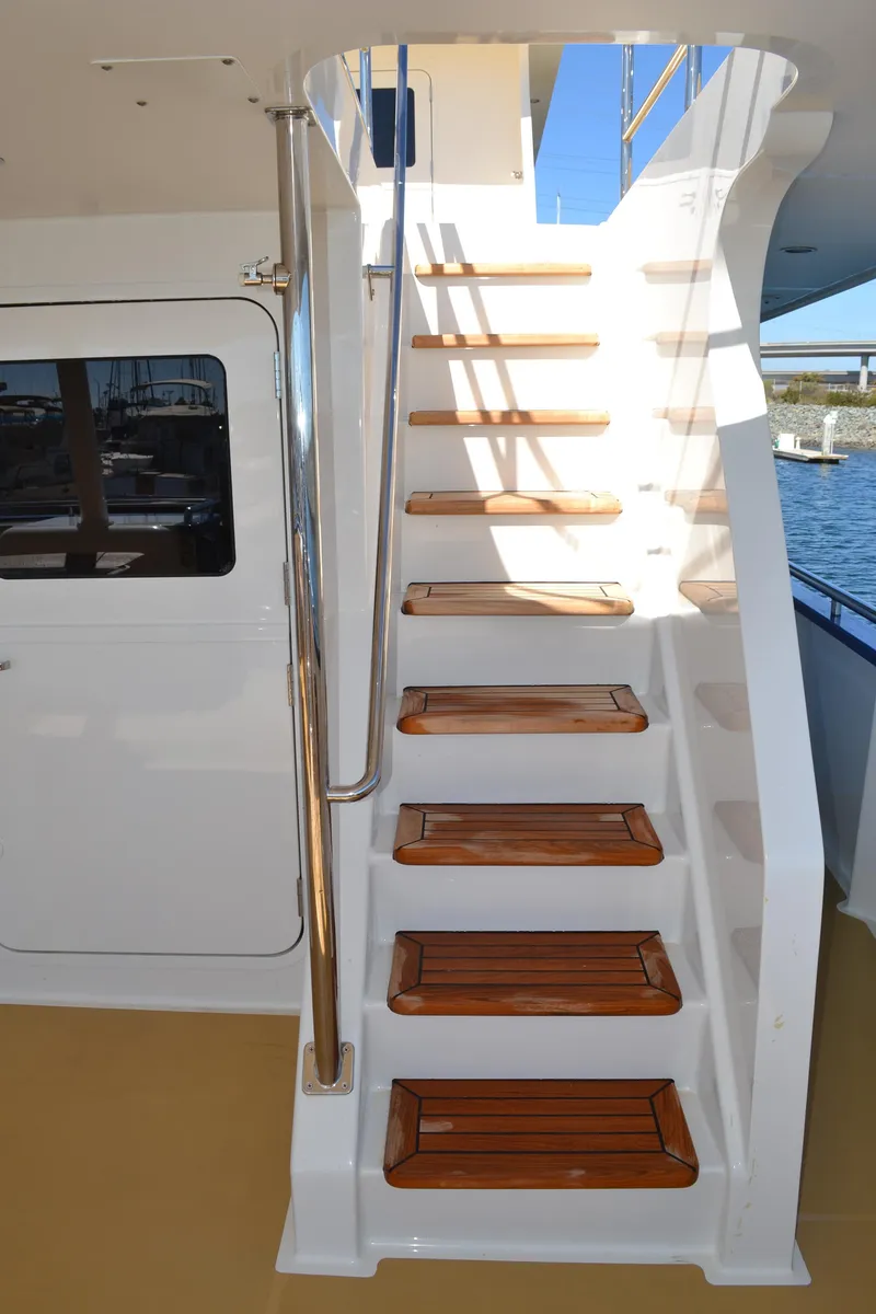 Slide: The Image of Staircase on 2018 Allseas Expedition yacht with wooden steps and metal railing. - 33