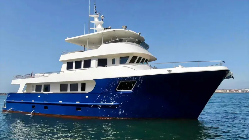 Slide: The Image of Allseas Expedition 2018 yacht with blue hull on calm sea under clear sky. - 5