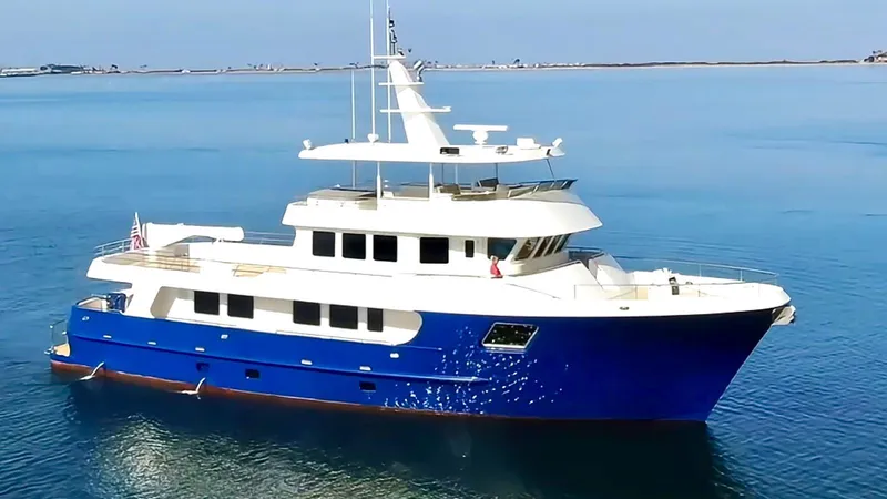 Slide: The Image of Luxurious 2018 Allseas Expedition yacht with blue hull, cruising on calm waters. - 8