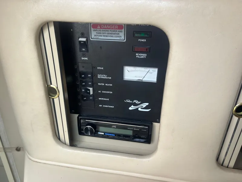 Slide: The Image of Control panel of 1995 Sea Ray 250 Sundancer boat with JVC stereo system. - 16