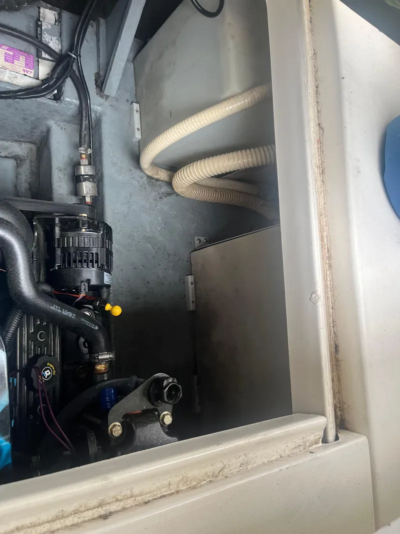 Slide: The Image of Engine compartment of a 1995 Sea Ray 250 Sundancer boat. - 35