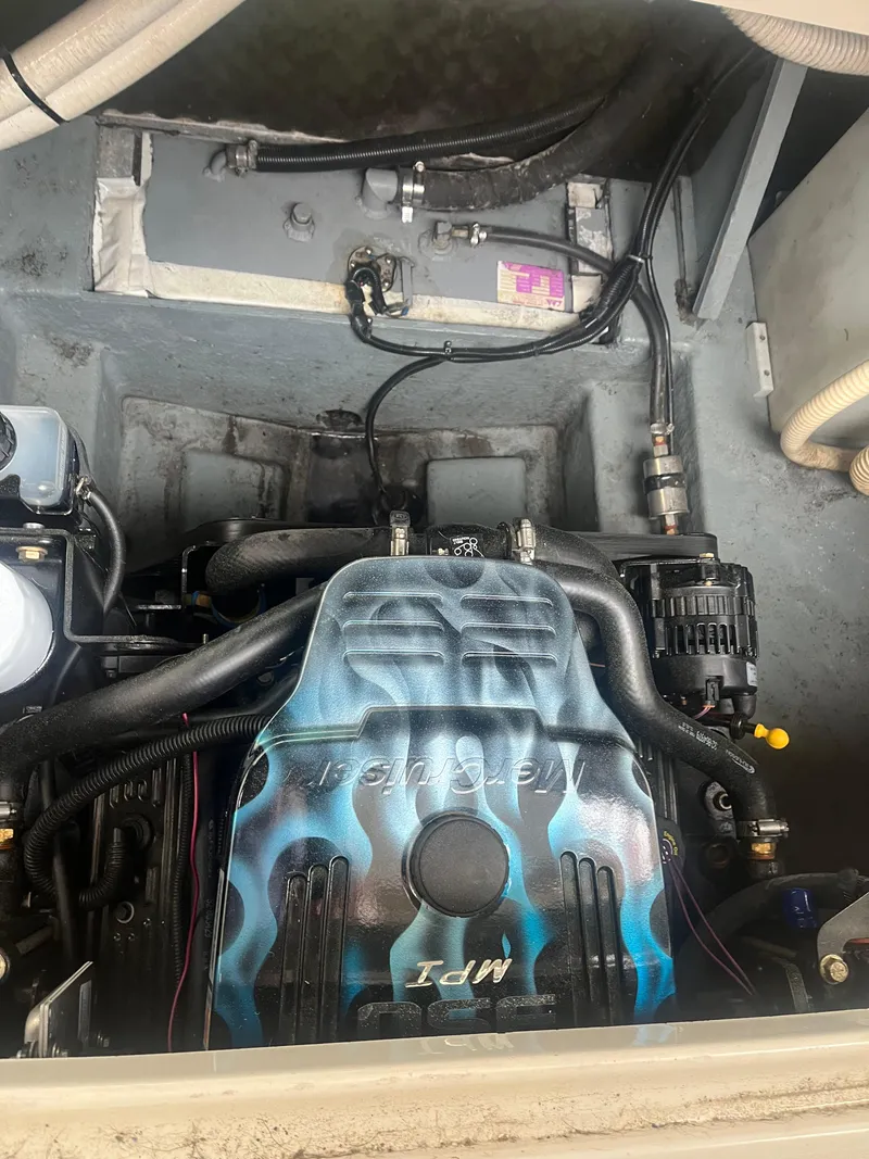 Slide: The Image of 1995 Sea Ray 250 Sundancer engine compartment with custom-painted engine cover. - 36