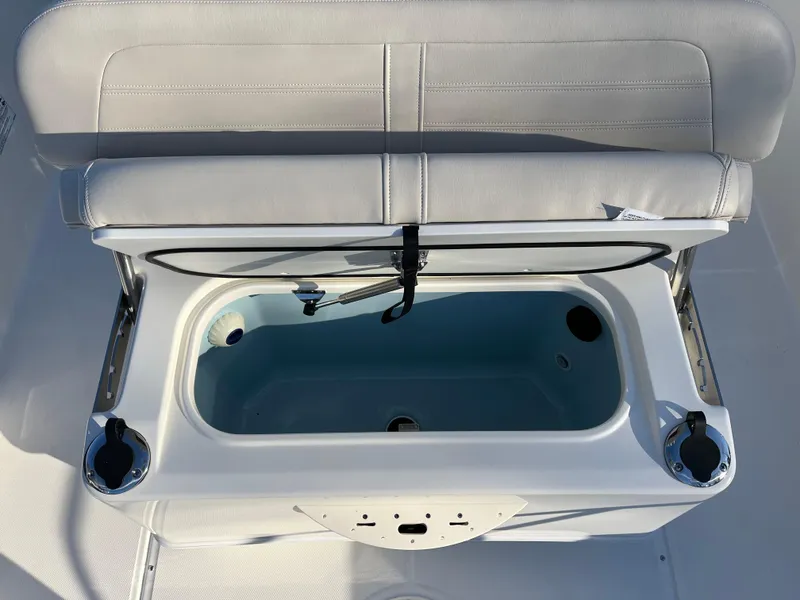 Slide: The Image of 2025 Boston Whaler 210 Montauk boat seat with integrated storage compartment. - 11