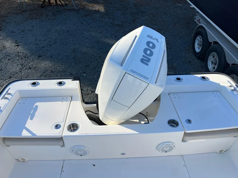 Slide: The Image of 2025 Boston Whaler 210 Montauk boat with powerful outboard motor, viewed from above. - 17