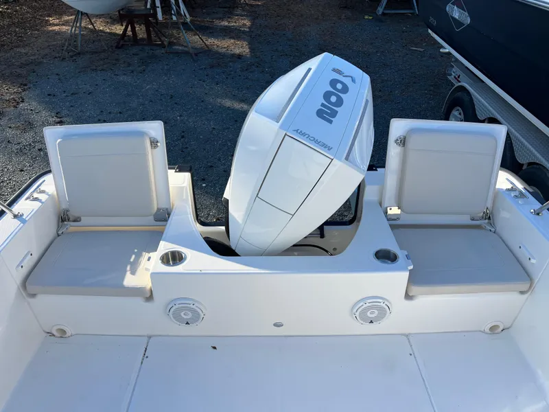Slide: The Image of 2025 Boston Whaler 210 Montauk boat with dual seating and outboard motor. - 8