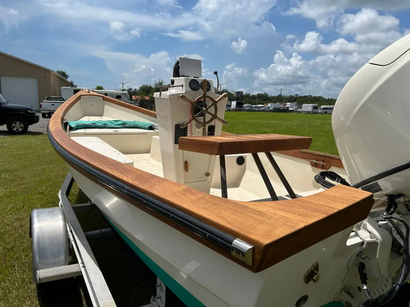 Slide: The Image of 2005 Caribiana Skiff boat on trailer under a sunny sky. - 3