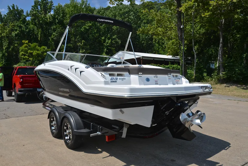 Slide: The Image of 2019 Chaparral 23 H20 boat on trailer, parked outdoors. - 12
