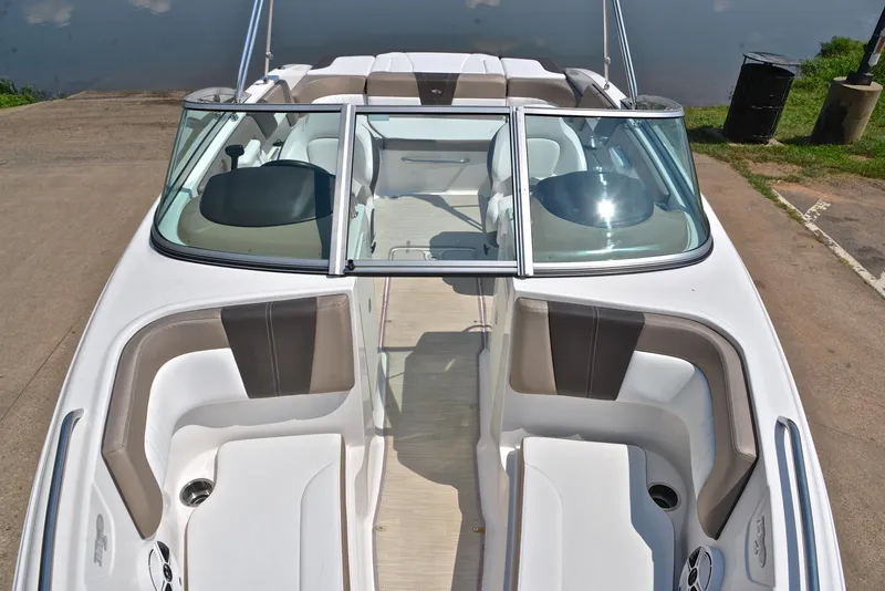Slide: The Image of 2019 Chaparral 23 H20 boat interior with seating and windshield. - 20