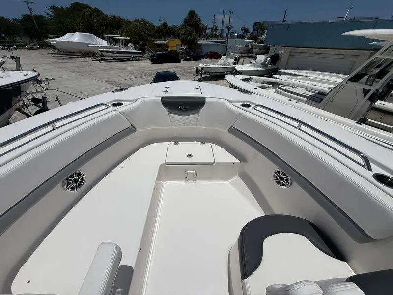 Slide: The Image of 2024 Robalo R317 Dual Console boat interior with spacious seating and sleek design. - 4
