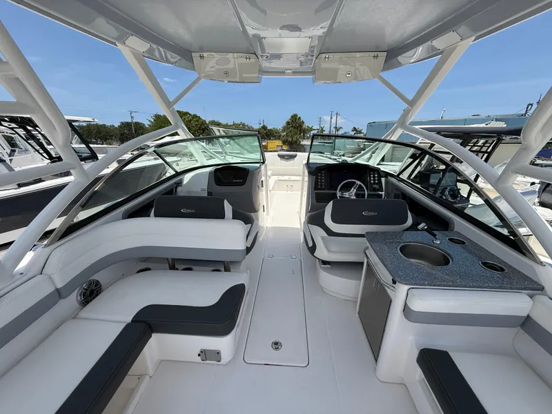 Slide: The Image of 2024 Robalo R317 Dual Console boat interior with seating and helm. - 9