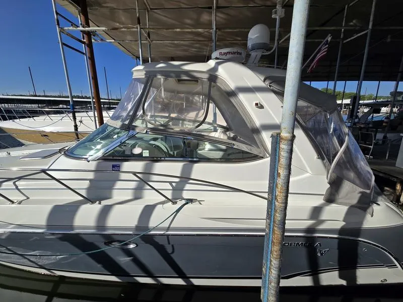 Slide: The Image of 2008 Formula 37 PC yacht docked under a canopy, side view. - 11