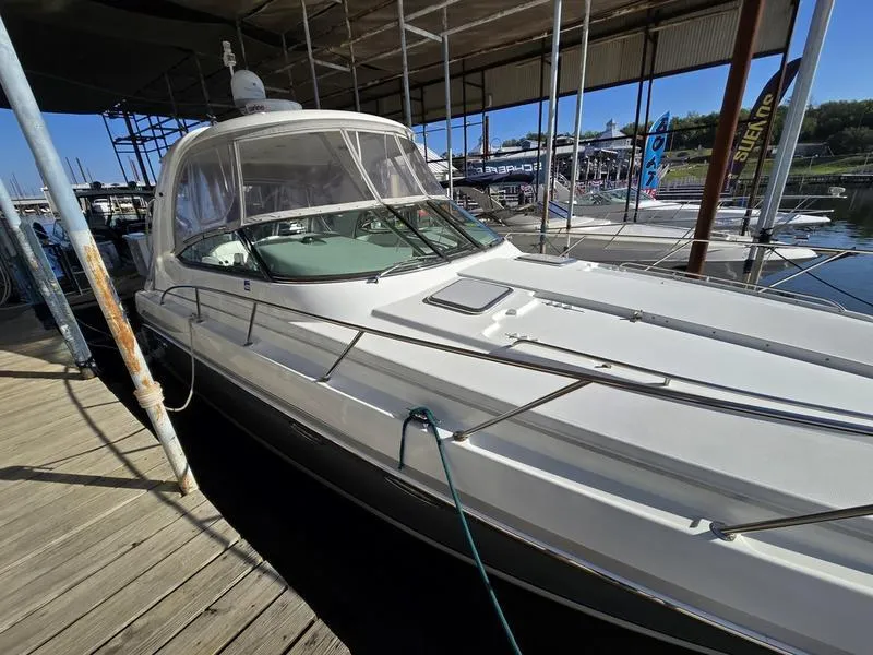Slide: The Image of 2008 Formula 37 PC yacht docked in a marina under a covered structure. - 16
