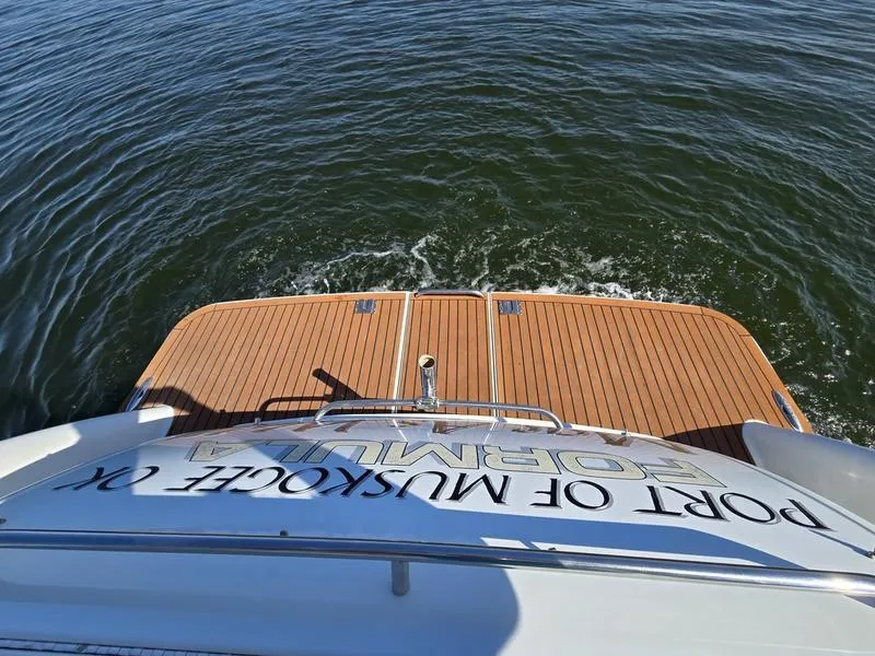 Slide: The Image of 2008 Formula 37 PC yacht with teak swim platform on calm water. - 17