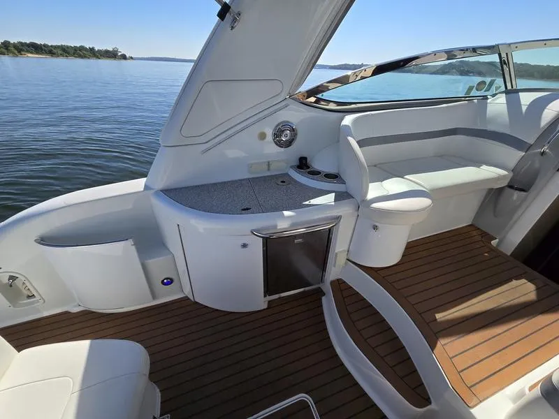 Slide: The Image of 2008 Formula 37 PC yacht interior with seating, wooden deck, and water view. - 18