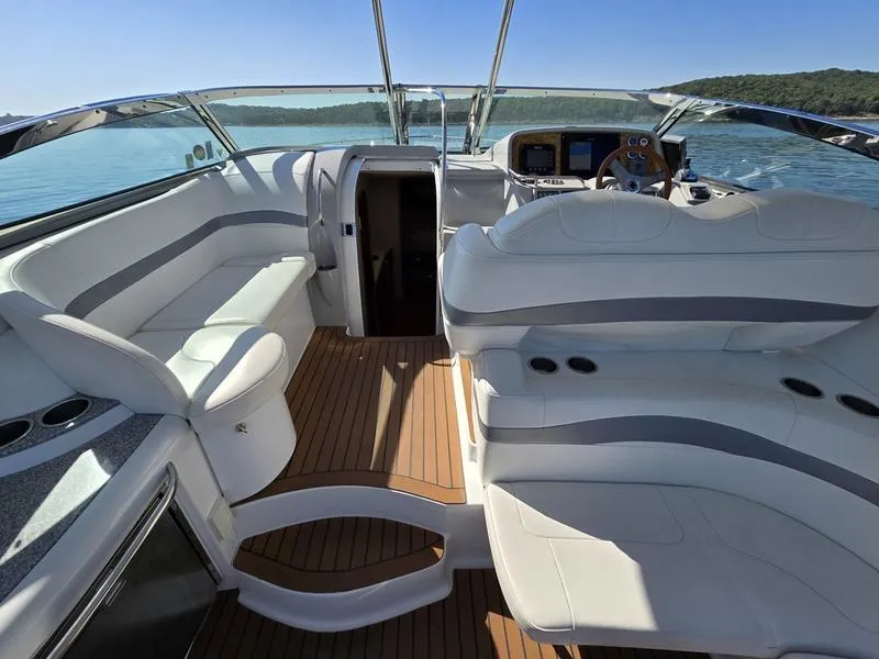 Slide: The Image of 2008 Formula 37 PC yacht interior with luxurious seating and modern dashboard on open water. - 22