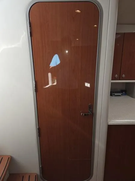 Slide: The Image of 2008 Formula 37 PC cabin door with wood finish and modern interior design. - 28