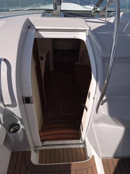 Slide: The Image of 2008 Formula 37 PC yacht cabin entrance with wooden flooring and sleek design. - 29