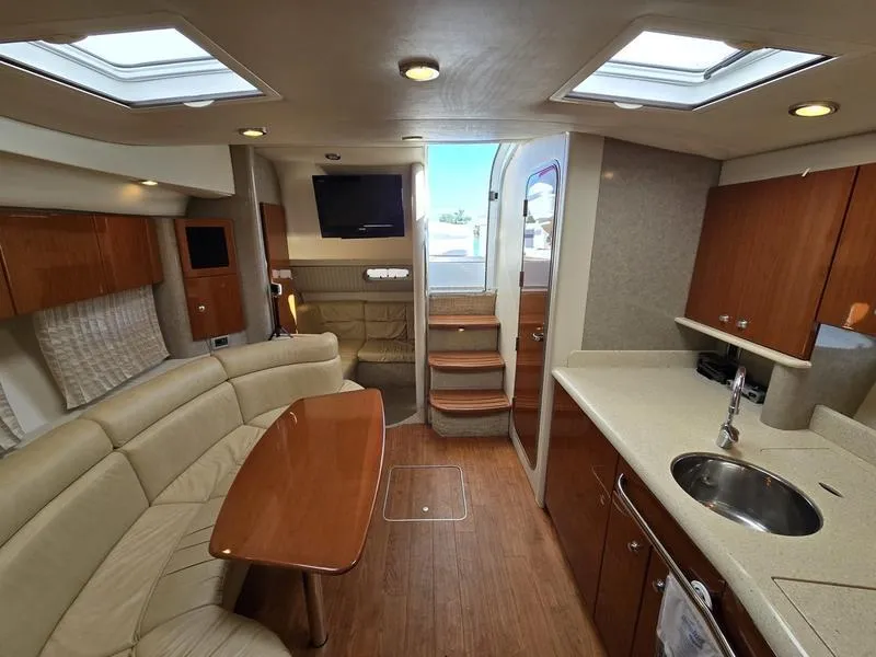 Slide: The Image of Interior of a 2008 Formula 37 PC yacht with modern kitchen and seating area. - 3